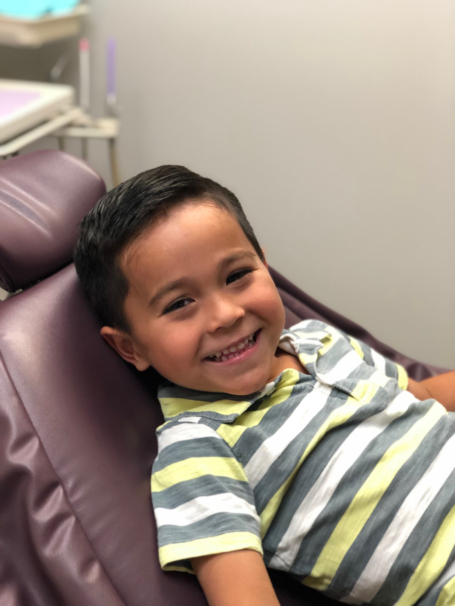 Happy child in dentist chair