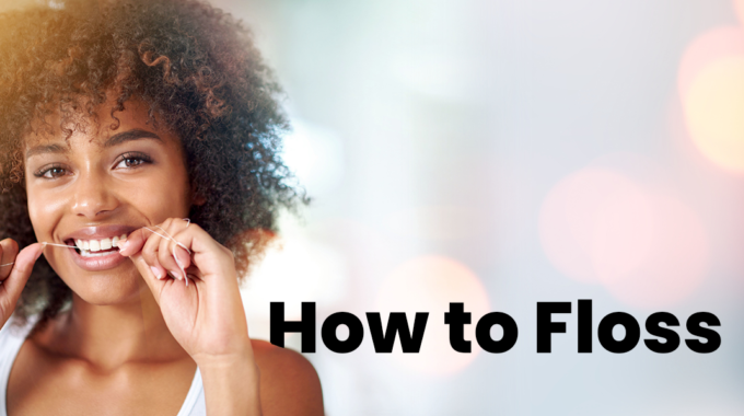 an image for a blog describing how to floss. It is a woman flossing her teeth and the text how to floss.